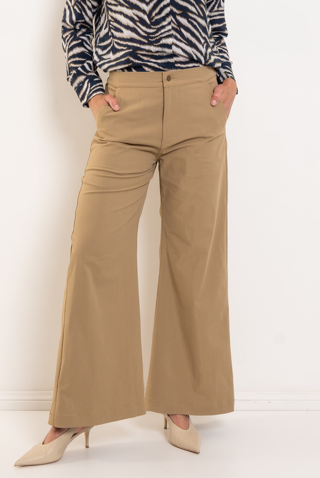 Philippa wears size 10 in Trench colour